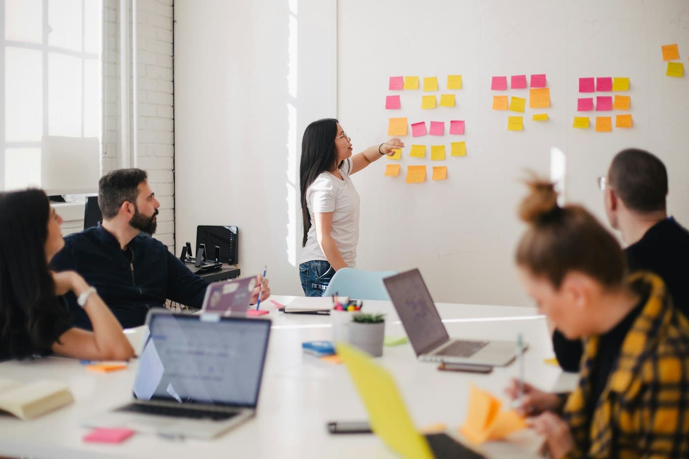 Business owners reviewing plans in a meeting