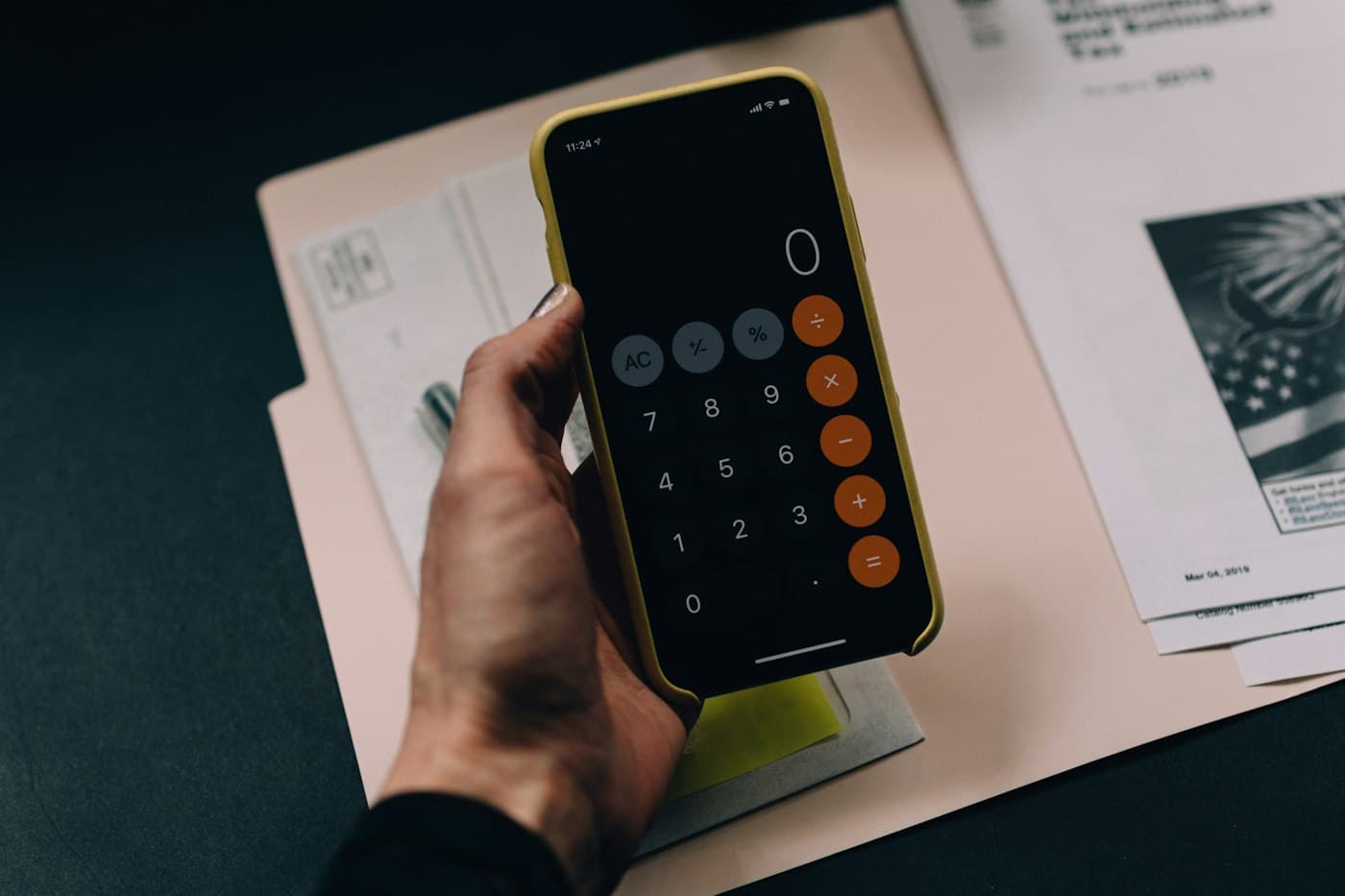 Bookkeeping ledger, laptop, and calculator